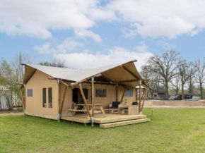 Tent with shower and kitchen, on a pop-up campsite